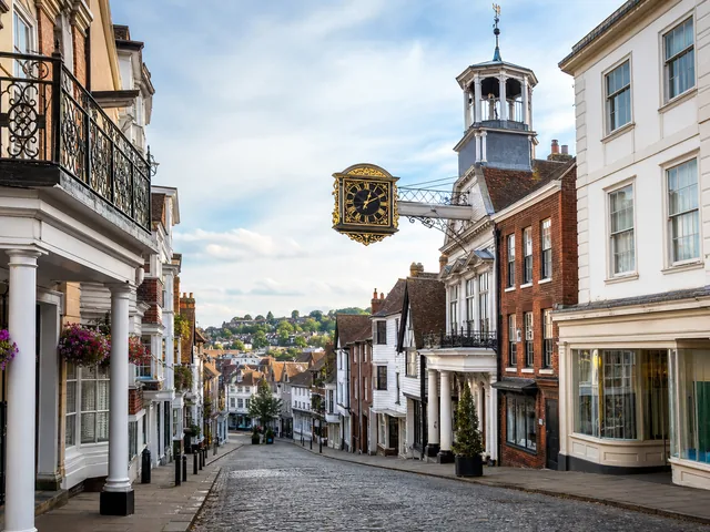 Illustrated view down Guildford High Street towards the Guildhall clock